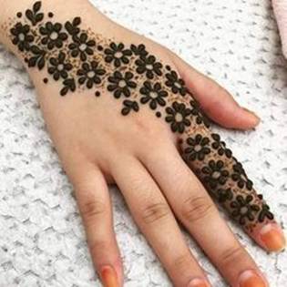 13. Flowery design in Arabic Mehndi for  brides