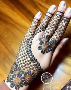 38. Flowery mesh design in Arabic Mehndi for brides