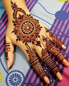 44. Floral mandala and mesh fingers design in Arabic Mehndi for brides