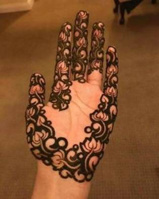 50. Lotus trail with uncovered palm in Arabic Mehndi for brides