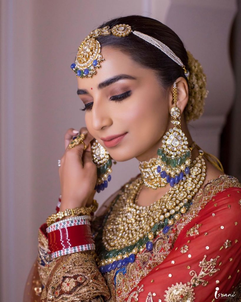 Brides who opted for subtle makeup with their red lehenga - Fab Weddings